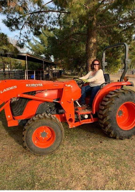 Cathy &lsquo;Grammy&rsquo; Jordan on the ranch tractor